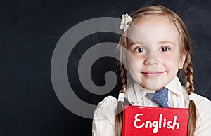 Kids learn english concept. Closeup portrait of cute child girl