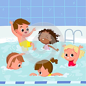 Kids learn how to swim on swimming lesson in aquatics centre photo