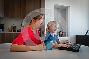 Kids learning remotely with father works from home, family stay idoors