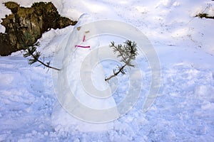 Kids made Snowman in Canillo village outdoor park. Andorra. photo