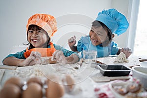 Kids make some dough and cookies together