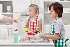 Kids ordered to do the dishes photo