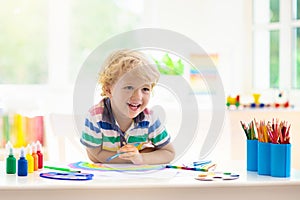 Kids paint. Child painting. Little boy drawing