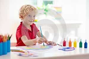 Kids paint. Child painting. Little boy drawing