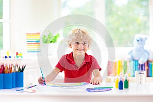 Kids paint. Child painting. Little boy drawing