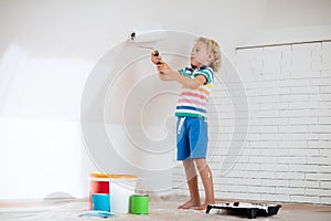 Kids painting attic wall. Home improvement