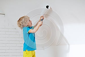Kids painting attic wall. Home improvement