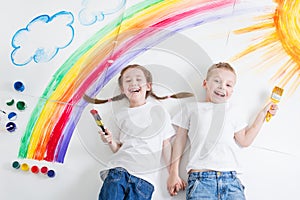 Kids painting rainbow