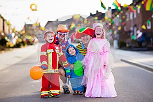 Kids and parents on Halloween trick or treat