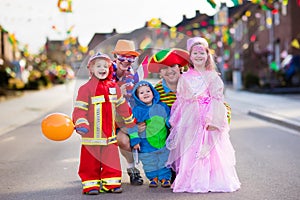 Kids and parents on Halloween trick or treat