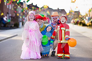 Kids and parents on Halloween trick or treat