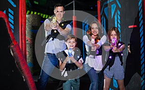 Kids with parents during lasertag game