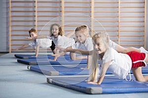 Kids improving coordination and balance at school photo