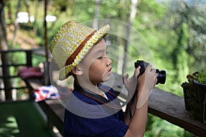 Kids photographer, Thai country boys with digital camera.