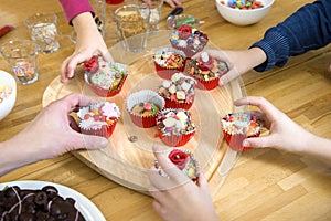 Kids Picking Cupcakes At Table