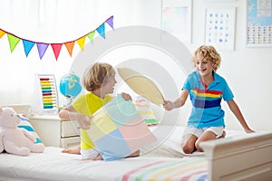 Kids pillow fight. Bedroom for two children