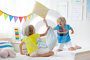 Kids pillow fight. Bedroom for two children