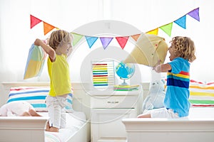 Kids pillow fight. Bedroom for two children