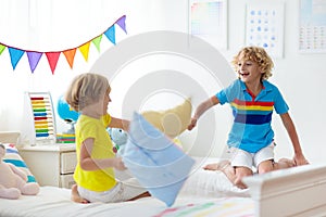 Kids pillow fight. Bedroom for two children