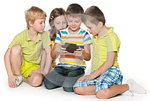 Kids plaing with a gadget