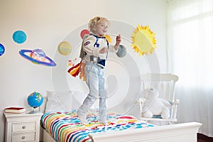 Kids play astronaut. Space and planet child game