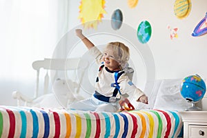 Kids play astronaut. Space and planet child game