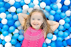 Kids play in ball pit. Child playing in balls pool