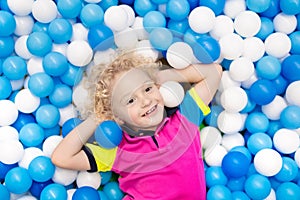 Kids play in ball pit. Child playing in balls pool