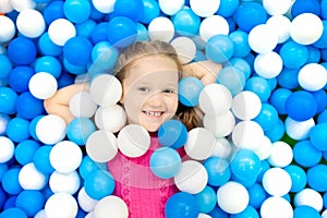 Kids play in ball pit. Child playing in balls pool