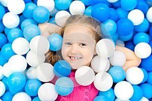 Kids play in ball pit. Child playing in balls pool