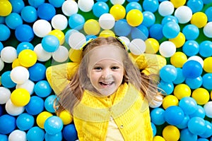 Kids play in ball pit. Child playing in balls pool