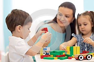 Kids play with block toy in nursery