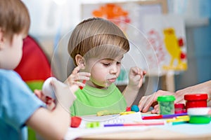 Kids with play clay at home