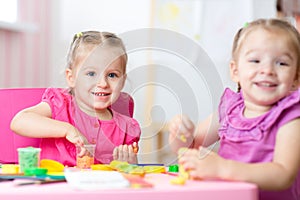 Kids with play clay at home