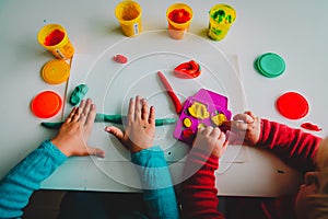 Kids play with clay molding shapes, learning and play