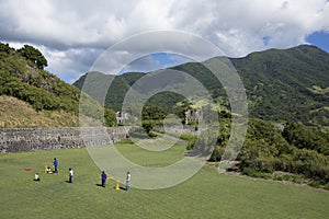 Kids play cricket on the island of St Kitts.