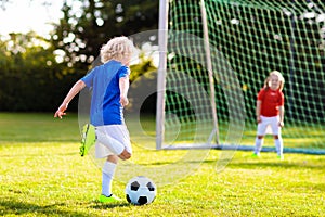 Kids play football. Child at soccer field