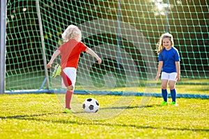 Kids play football. Child at soccer field