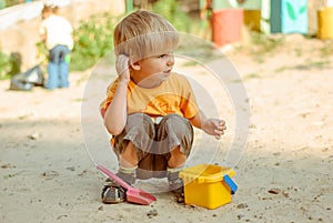 kids play in the sand box