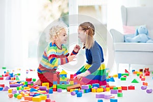 Kids play with toy blocks. Toys for children.