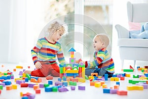 Kids play with toy blocks. Toys for children.