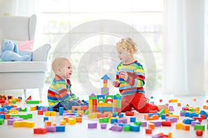 Kids play with toy blocks. Toys for children