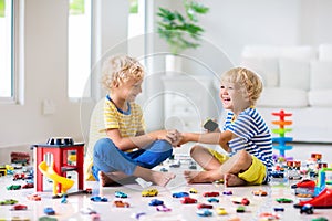 Kids play with toy cars. Children playing car toys