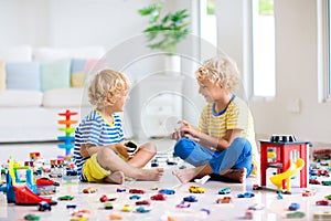 Kids play with toy cars. Children playing car toys