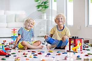 Kids play with toy cars. Children playing car toys