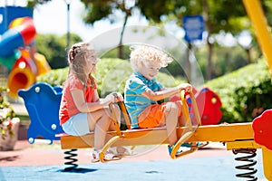 Kids on playground. Children play in summer park.