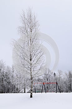 Kids playground on a snowy winter day.