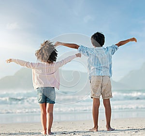 Kids, playing and airplane on beach, vacation or freedom on holiday in summer in Brazil with ocean, blue sky and