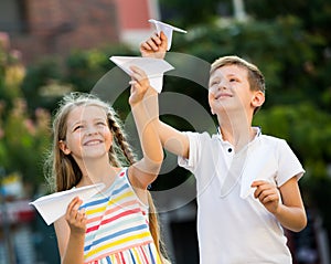 Kids playing airplane toys