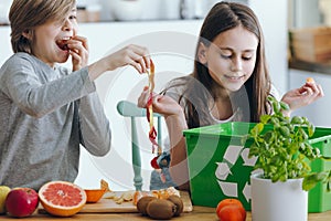 Kids playing with apple skin